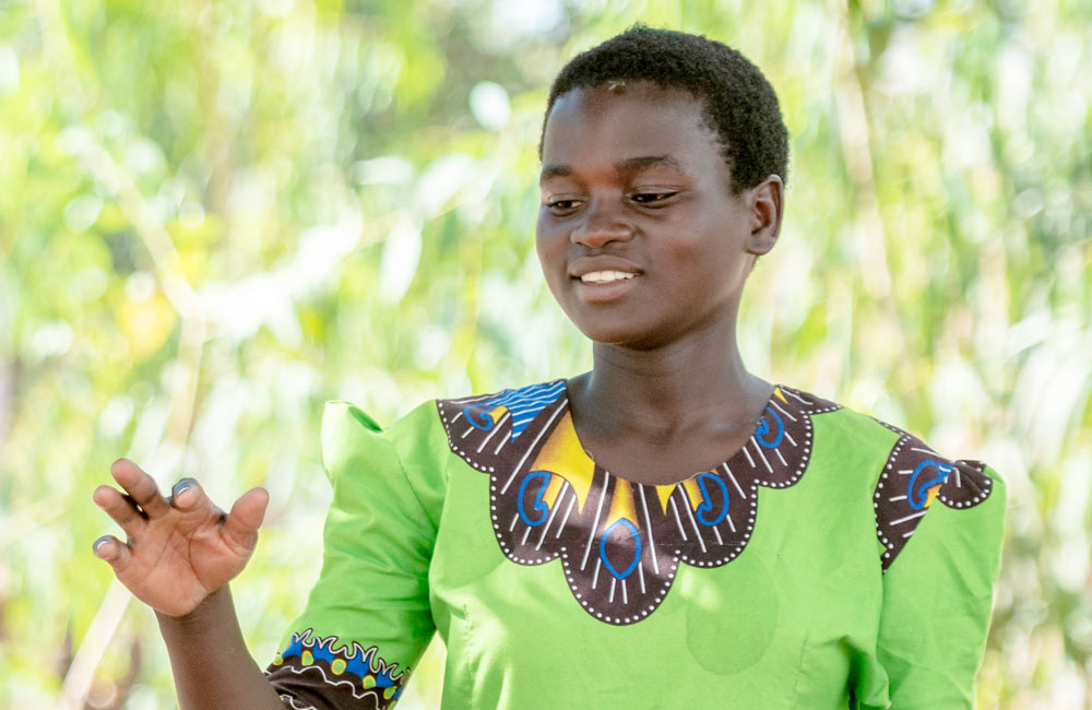 Jente som underviser i Malawi. Vi jobber med økonomisk selvstendighet for unge kvinner.